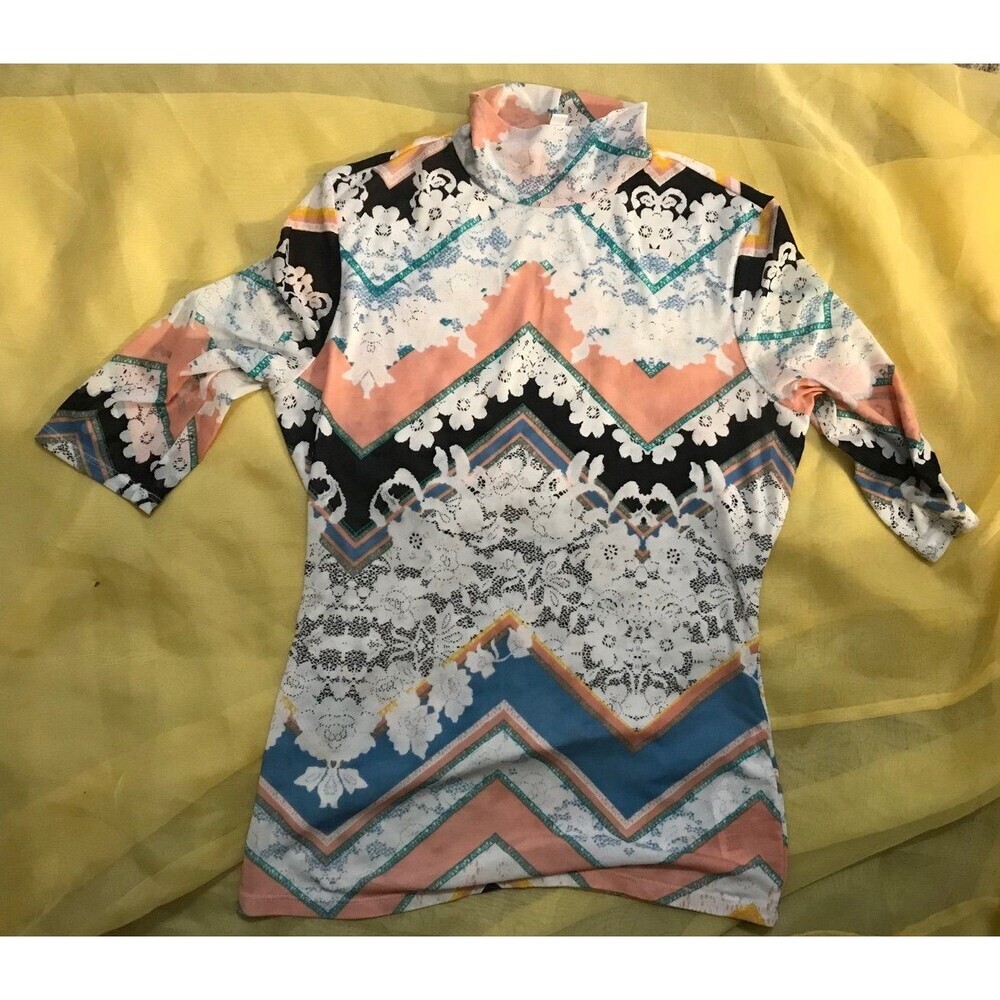 Guess mesh floral and Chevrons in a tight shirt size Small